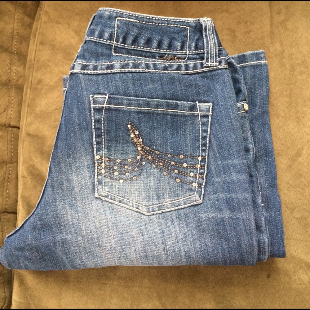 Ink denim curvy fit boot leg.
